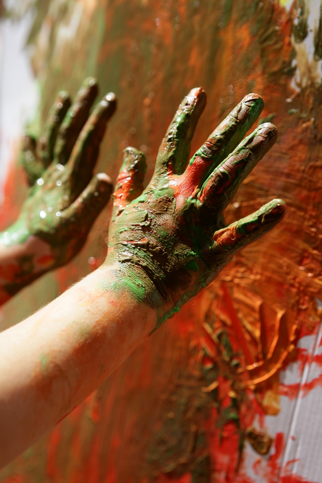 Children artist hands painting colorful